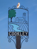 Cookley Village Sign. Photograph taken by Tim and Eileen 
                    Heaps, May 2001