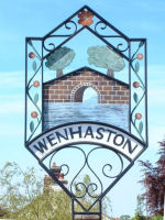 Wenhaston Village Sign. Photograph taken by Tim and Eileen
                    Heaps, May 2001