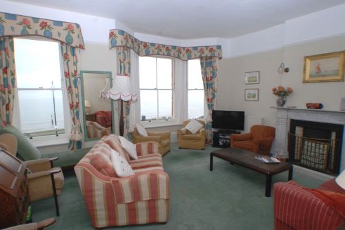 The spacious first floor sitting room enjoys superb views out to sea and down to the pier