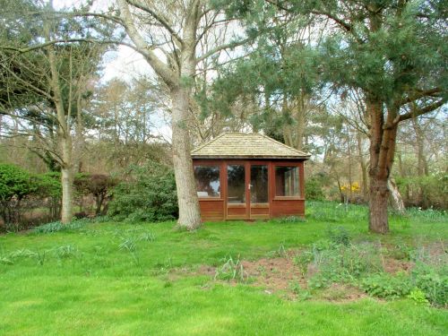 At the top of the garden is a summerhouse. The garden is visited by a variety of wildlife including deer and rabbits whilst robins, coal tits, finches and even woodpeckers regularly come to the birdtable.