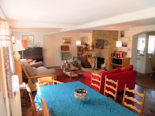 The large living room at 1 Little Dingle, with the dining table in the foreground