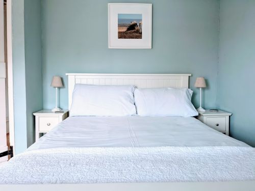 Front bedroom with wide oak beamed floor