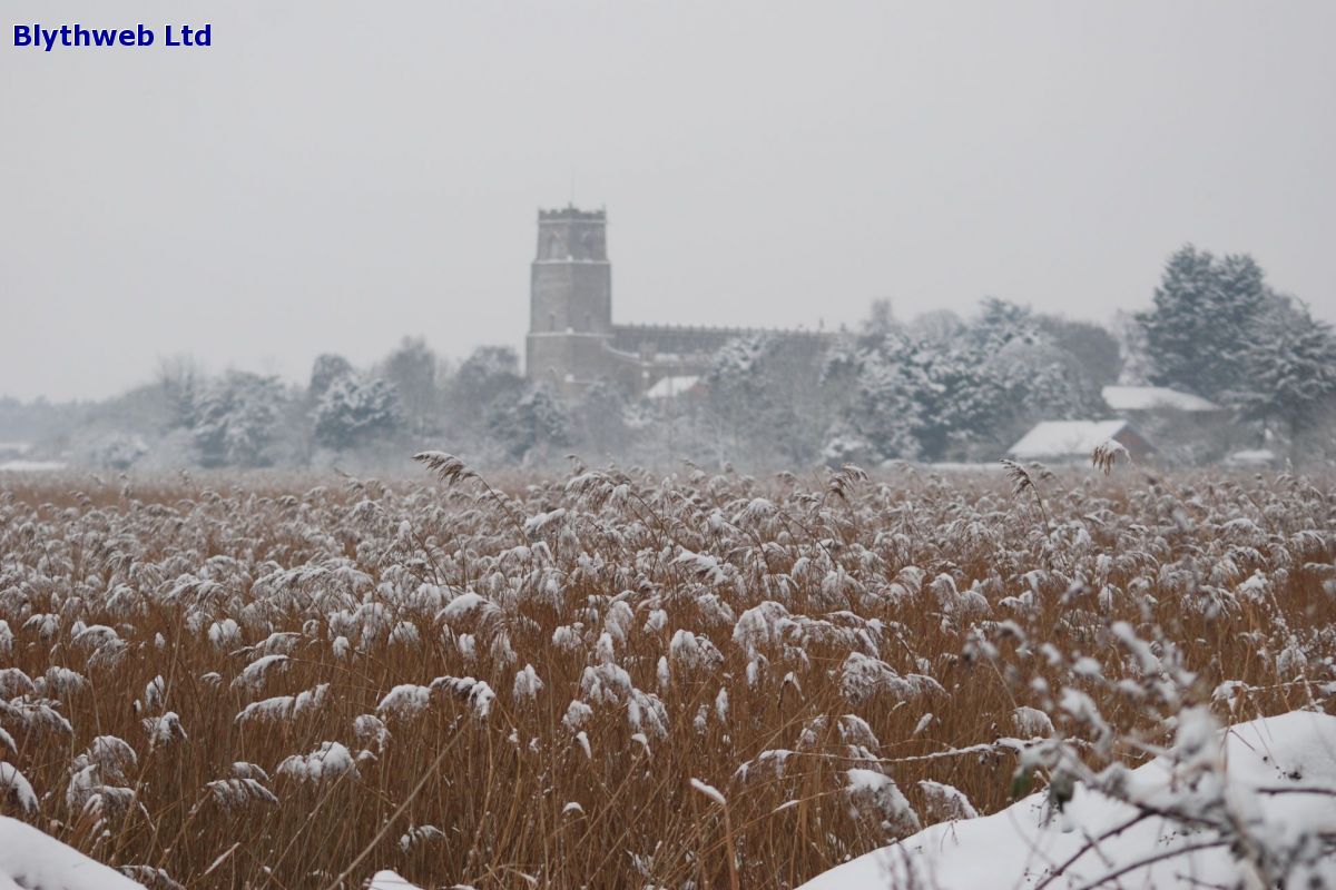 Blythburgh Church seen across snowy reeds